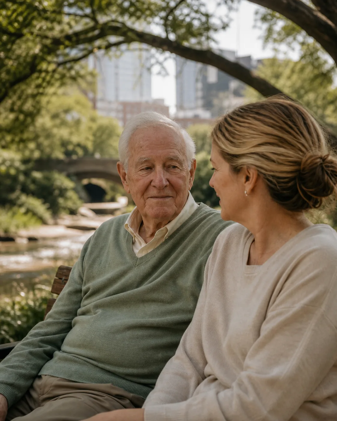 An older adult and companion resting beside Turtle Creek