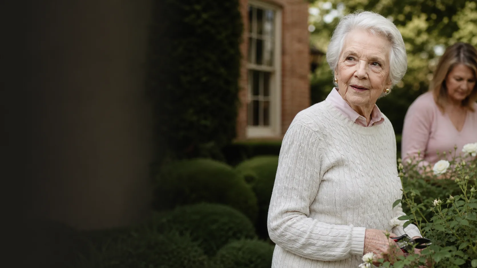An older adult walking outdoors with a companion
