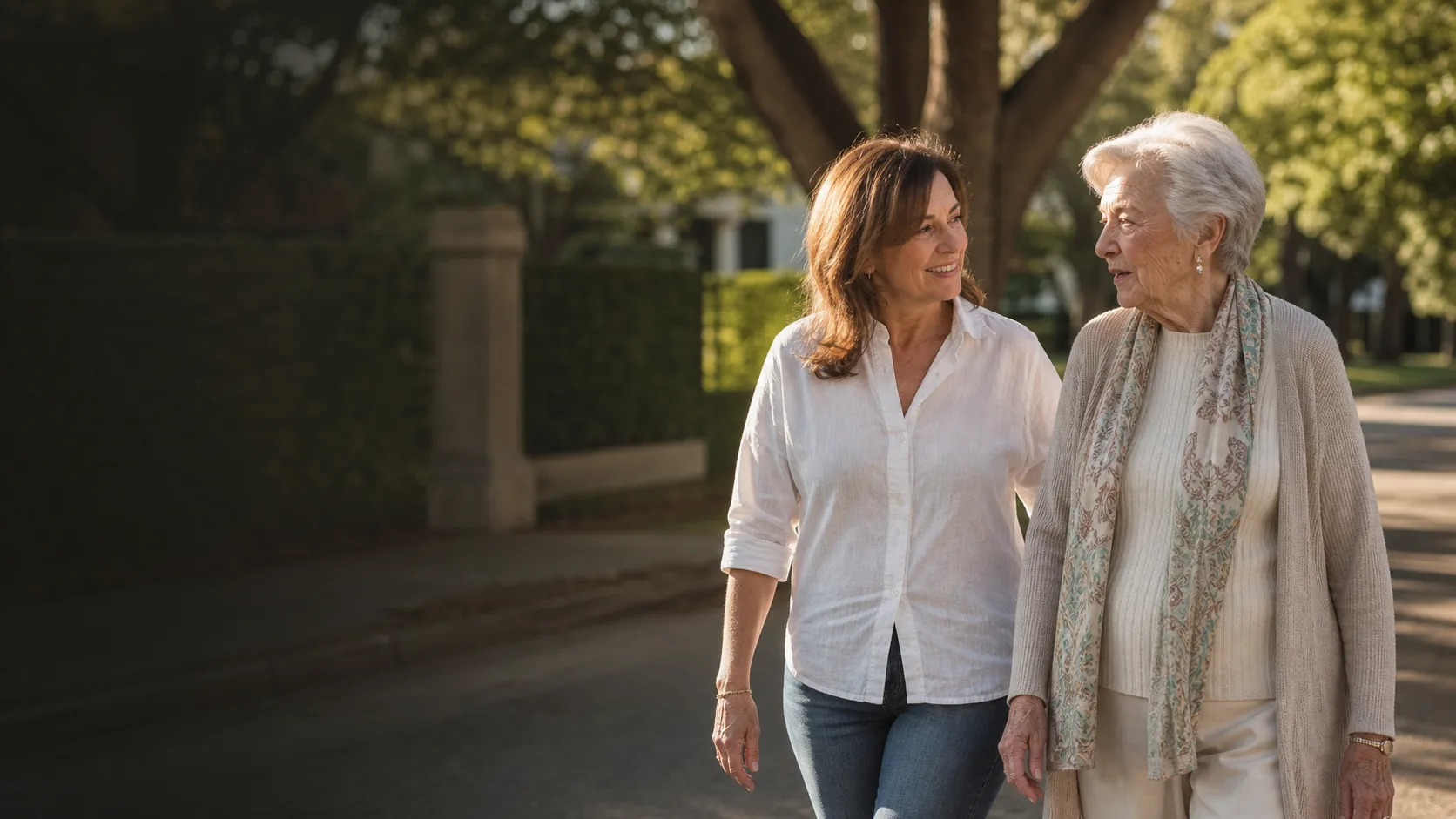 An older adult walking outdoors alongside a companion
